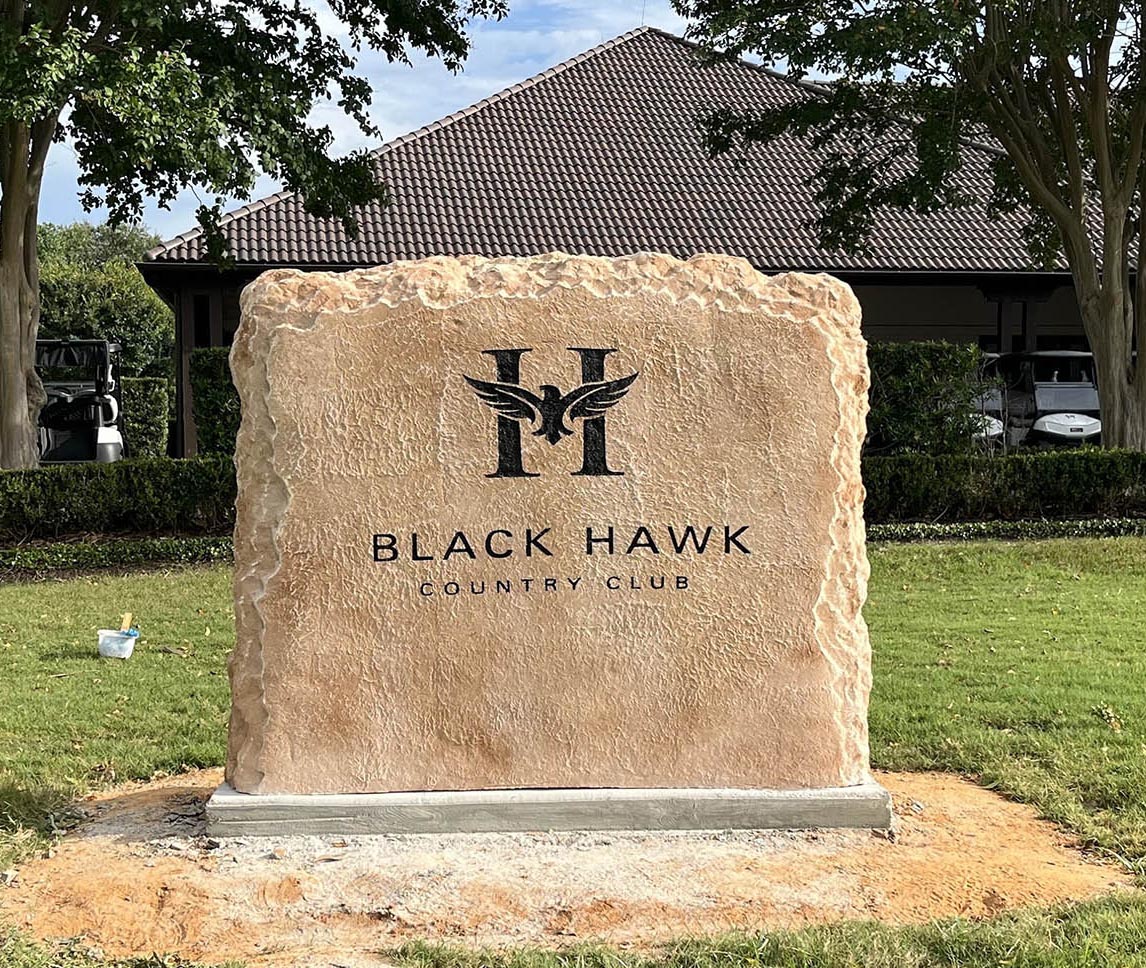 Custom commercial sign made of cultured stone in Houston by Bedrock Boulders