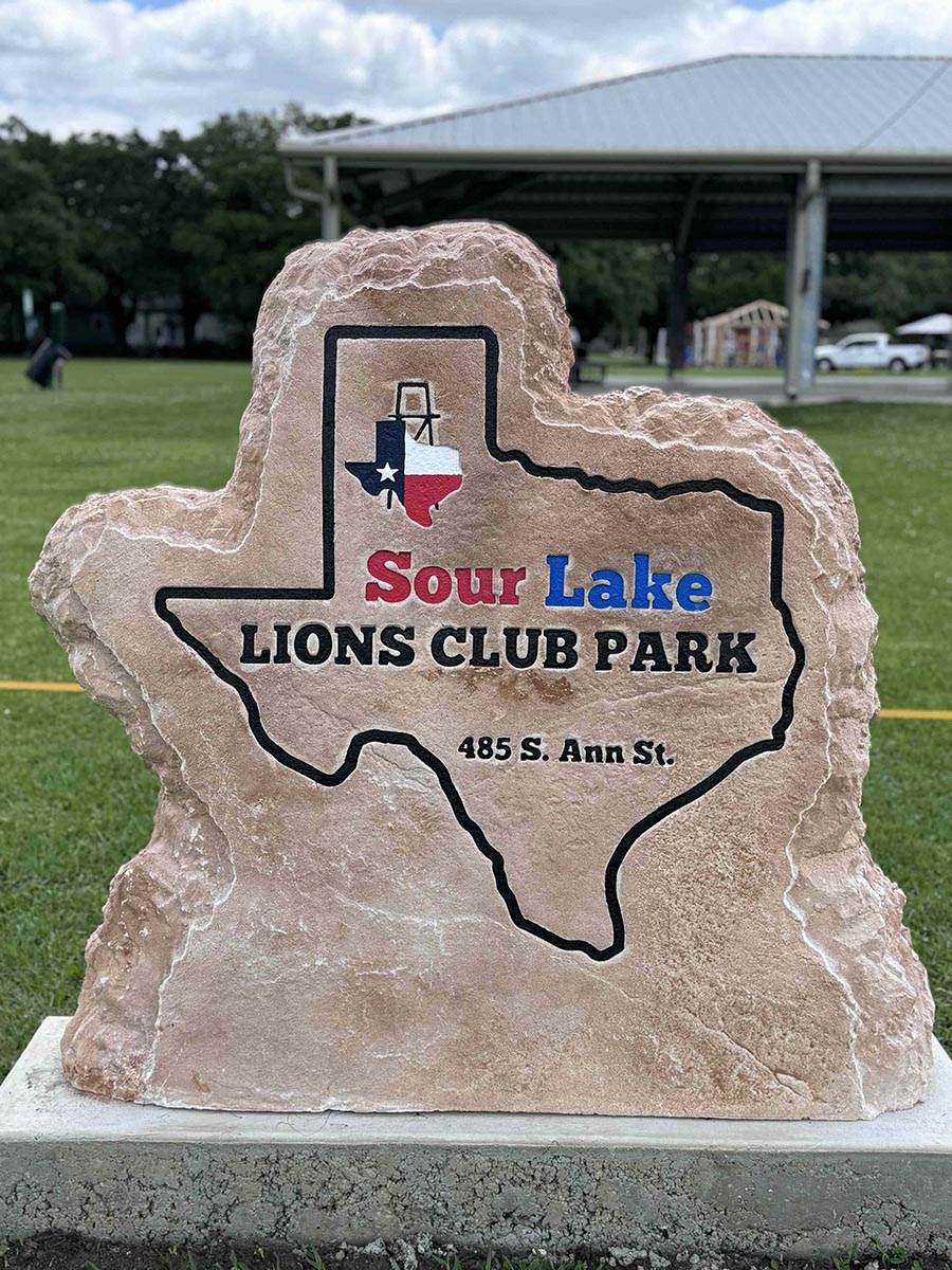 Custom commercial sign made of cultured stone in Houston by Bedrock Boulders