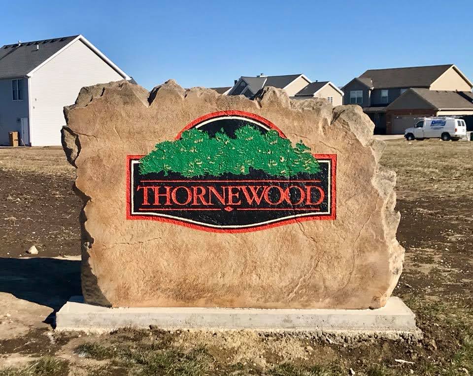 Custom commercial sign made of cultured stone in Houston by Bedrock Boulders