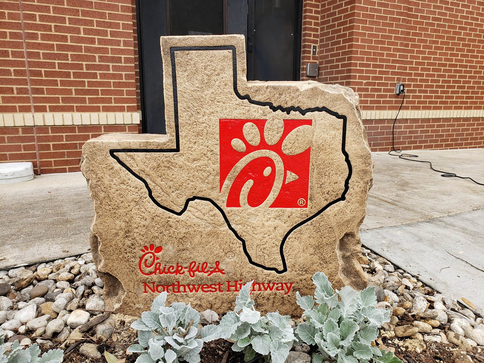 Custom commercial sign made of cultured stone in Houston by Bedrock Boulders